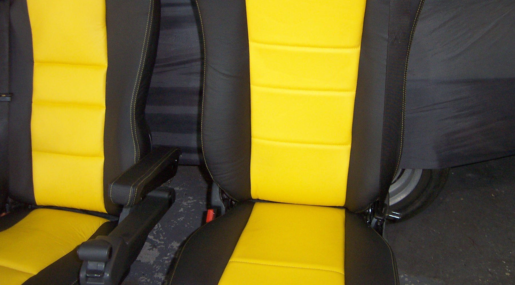 Yellow+and+black+seating+with+yellow+stitching
